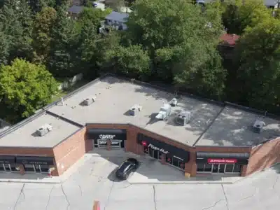Flat Roof Replacement Aerial View | Finished project by Videl Roofing Company