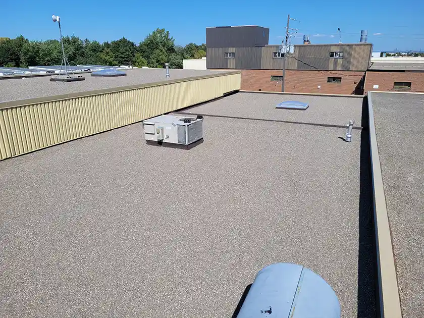One of three skylights retrofitted into a commercial shop area during a flat roof replacement in Brampton by Videl Roofing