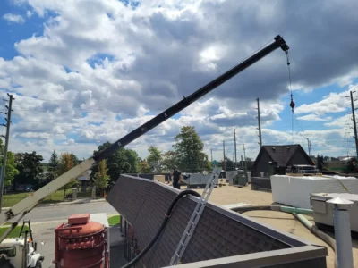 Skilled hands securing new roofing materials in place.