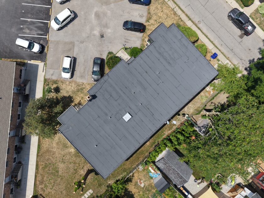 Overhead aerial view of completed apartment building roof replacement with two-ply modified bitumen system in St. Catharines.