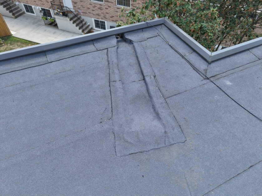 External scupper installed at the lowest point of tapered insulation for efficient water drainage.