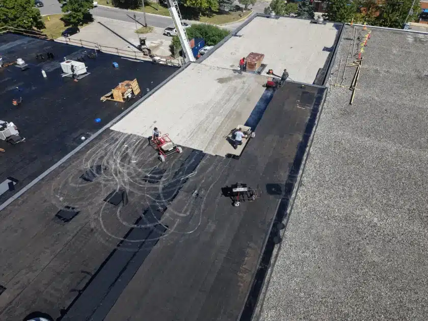 Videl Roofing Team Graveling the Flat Roof