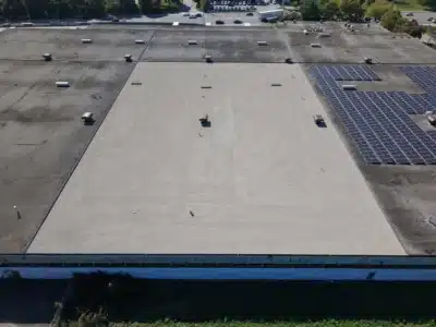 Finished flat roof in Burlington. This project maximized savings by reusing existing insulation and installing a new membrane.