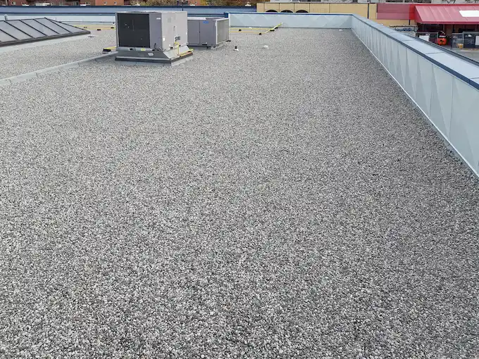 Built-up roofing system being installed on a 7,500 sq ft commercial flat roof in St. Catharines, Ontario