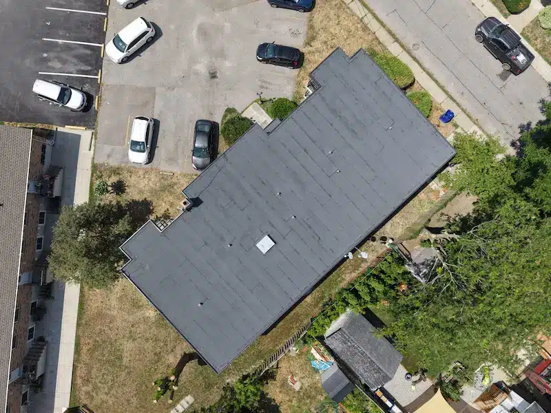 Overhead aerial view of completed apartment building roof replacement with two-ply modified bitumen system in St. Catharines