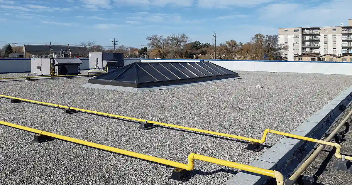 A 50-year-old pitch and tar roof on Scott Street had been ponding for years. We stripped 7,500 sq ft, installed new drains, and replaced it with a full BUR system.