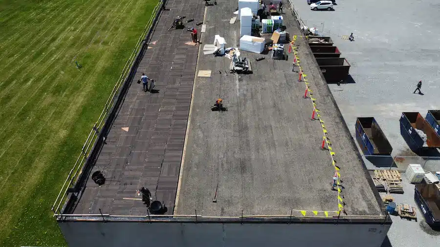 Videl Roofing contractors installing 0.5” fiberboard during Welland commercial flat roof replacement