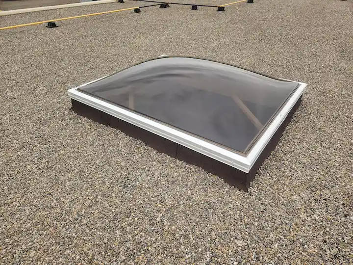 Final Step for skylight installation on flat roof in Ontario