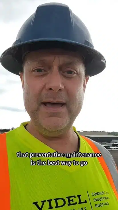 Kirby Hewines of Videl Roofing inspecting a commercial flat roof in the Niagara region, identifying damaged stacks, open pitch pockets, and membrane blisters before they become major repairs.