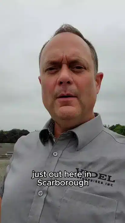 Videl Roofing crew inspecting a five-year-old commercial flat roof in Scarborough with membrane blistering, debris damage, and deteriorating insulation
